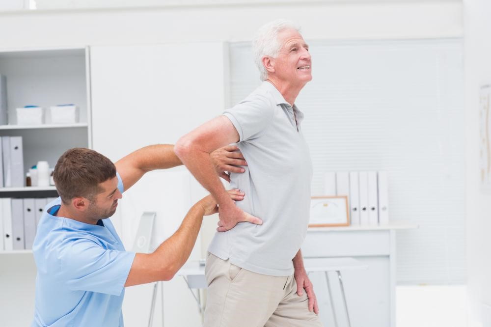 physical therapy assisting a senior citizen