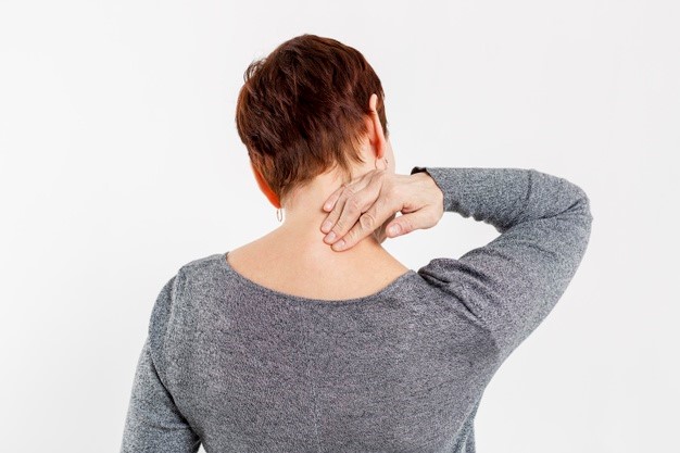 an individual experiencing back pain and neck pain