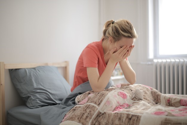 stressed woman experiencing menstrual pain