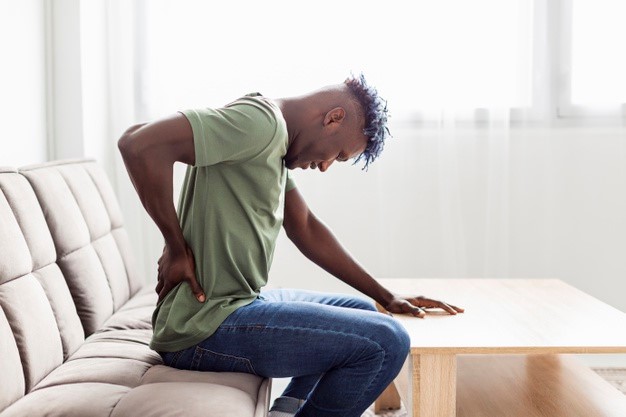a man experiencing debilitating back pain