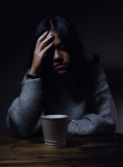 A woman experiencing a headache