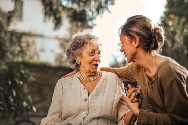 a woman caring for her mother with Parkinson’s disease