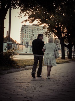 elderly couple walking to help exercise hips