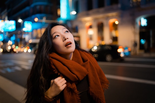 woman bending her neck to look up