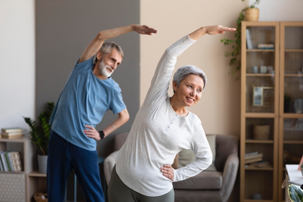 couple relieving back pain by stretching