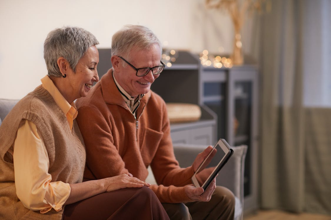 an elderly couple sitting together