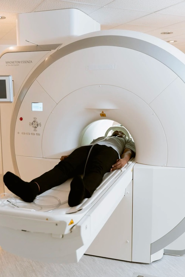 A patient gets an MRI in the machine. 