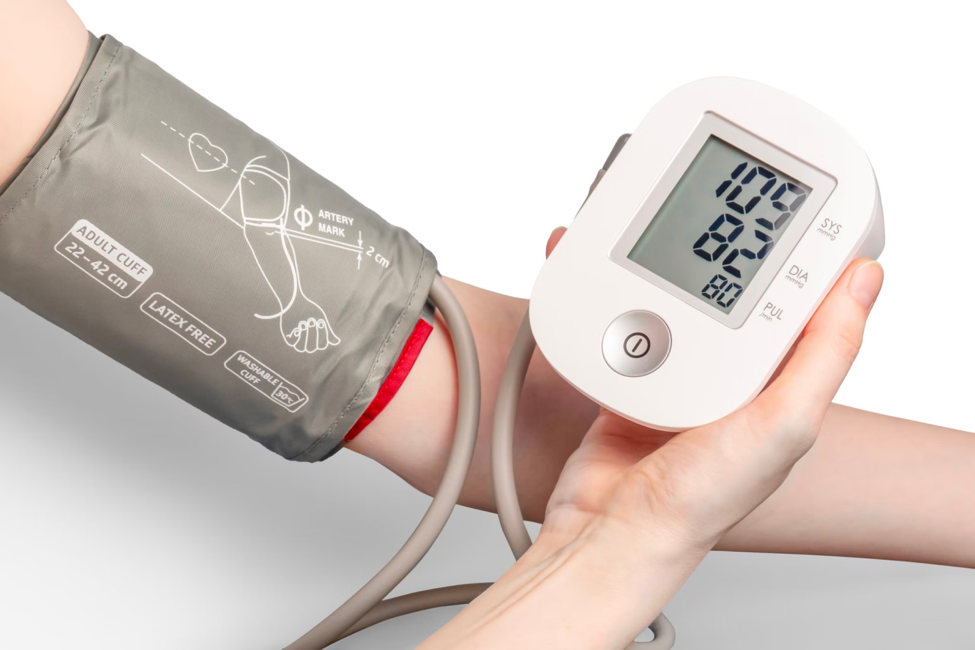  A person checks their blood pressure using a sphygmomanometer.