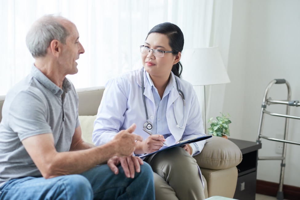 a spine specialist talking with a patient