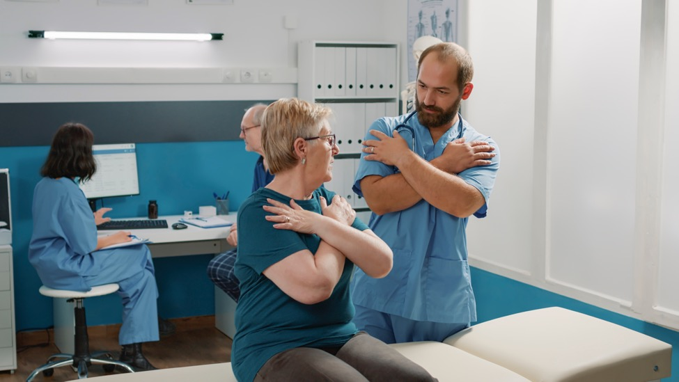 a physical therapist treating a patient after spine surgery