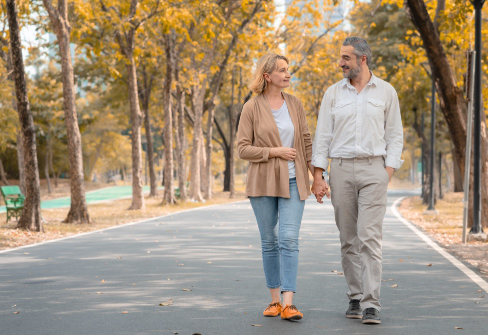 Man and woman walking in the park.