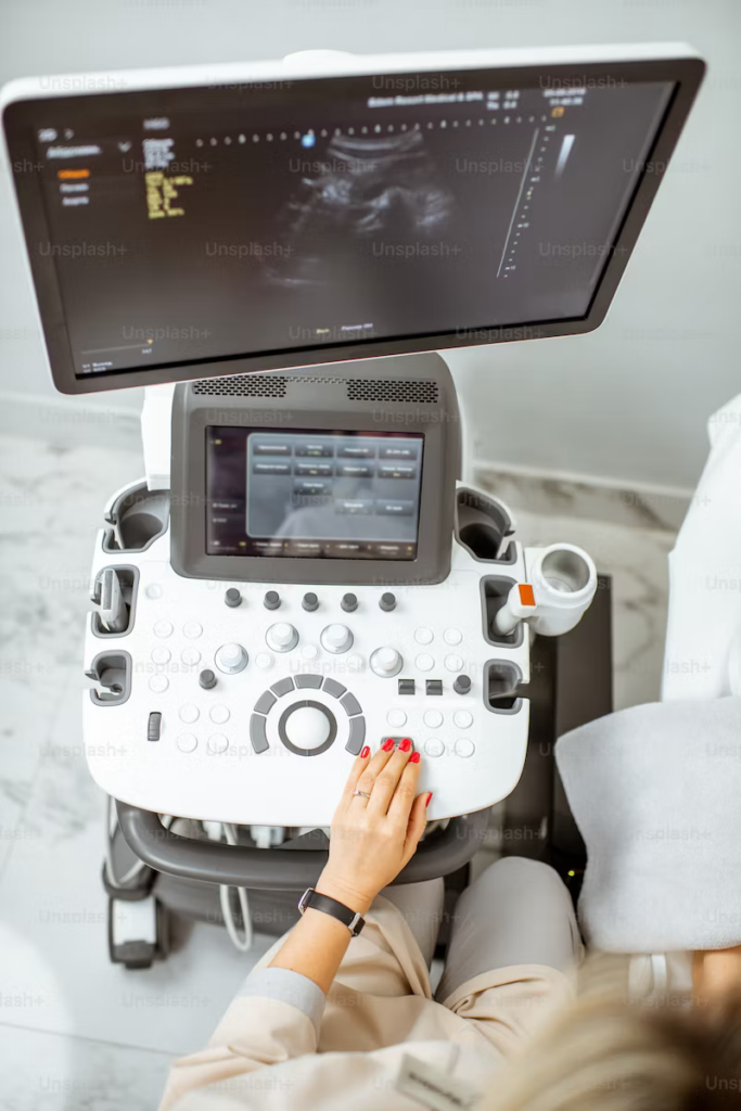 a technician using ultrasound equipment during a medical examination
