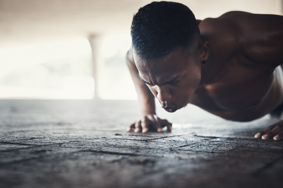 A man doing push-ups.